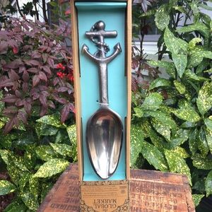 The Global Market silver anchor serving spoon